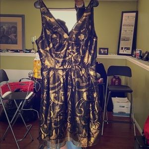 A black and gold evening cocktail dress